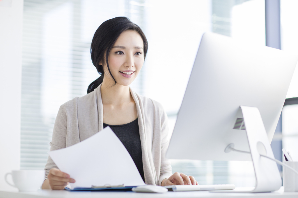 Young Chinese woman working in office